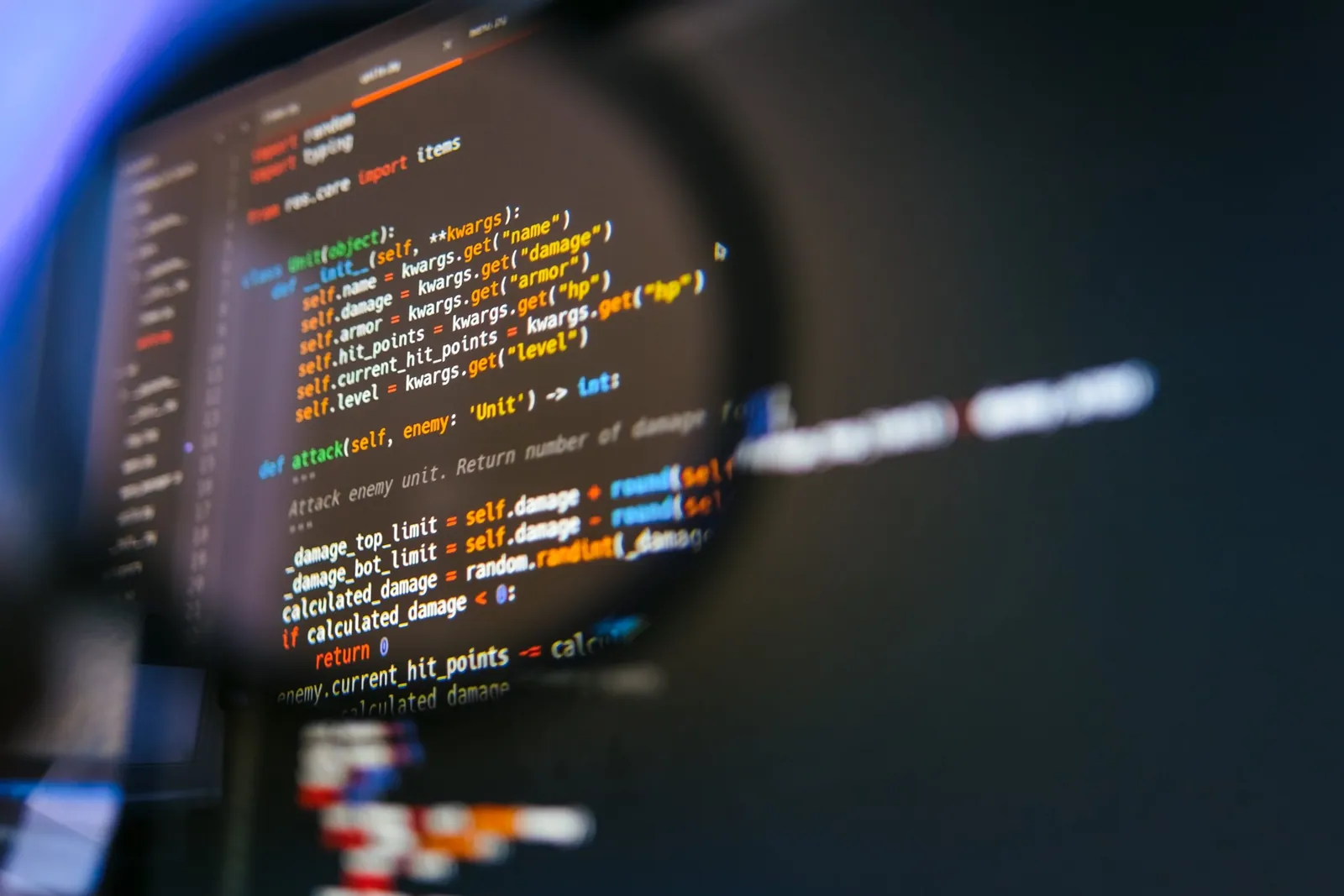 program code on computer display in magnifying gla 2022 04 28 02 46 28 utc 1 min